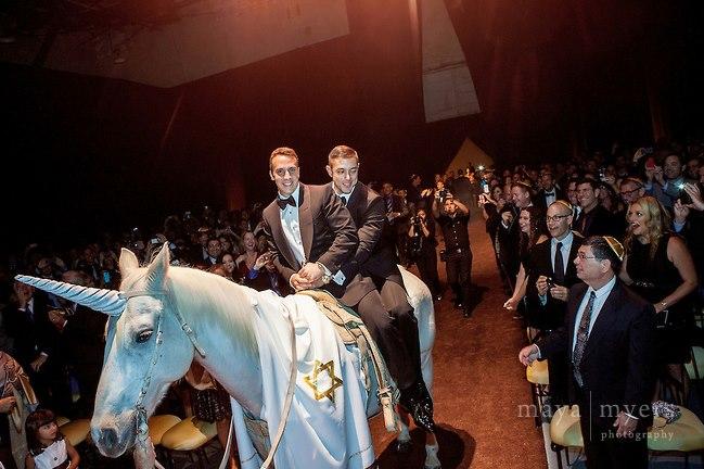 Internet goes wild over photo of two Jewish men riding a unicorn into their wedding